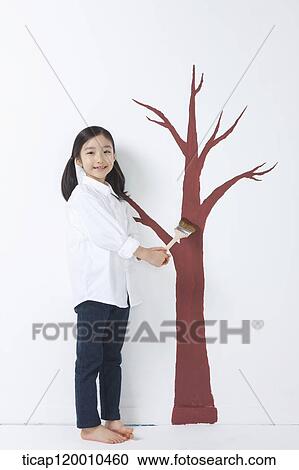 A girl painting the tree View Large Photo Image Stock Image - A girl painting the tree. Fotosearch