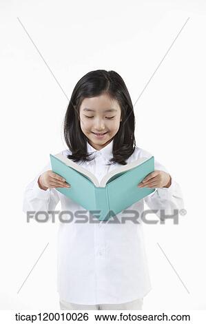 A girl reading a book View Large Photo Image Stock Photograph - A girl reading a book. Fotosearch