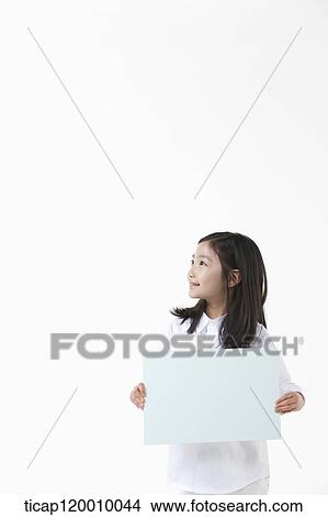 A girl smiling with white board View Large Photo Image Picture - A girl smiling with white board. Fotosearch