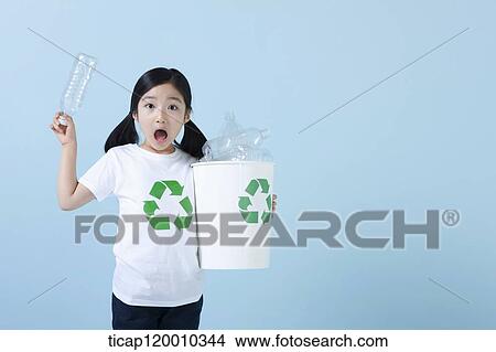 A girl surprised with recycling bin View Large Photo Image Picture - A girl surprised with recycling bin . Fotosearch