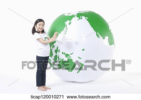 A girl watering a green globe View Large Photo Image Stock Image - A girl watering a green globe. Fotosearch