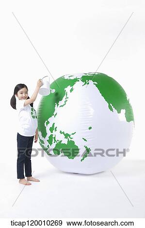 A girl watering a green globe View Large Photo Image Stock Photo - A girl watering a green globe. Fotosearch