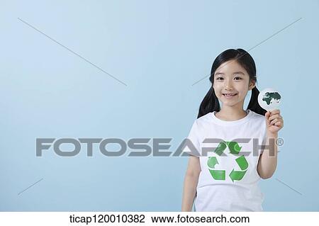 Stock Image - A girl wearing recycling shirt with globe light bulb. Fotosearch