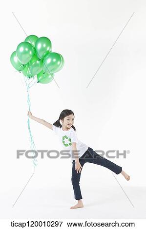 A girl wearing recycling shirt with green balloons View Large Photo Image Stock Photo - A girl wearing recycling shirt with green balloons. Fotosearch
