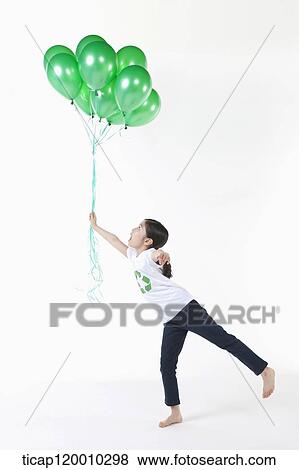 A girl wearing recycling shirt with green balloons View Large Photo Image Stock Photo - A girl wearing recycling shirt with green balloons. Fotosearch