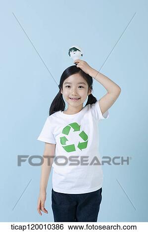 A girl wearing recycling shirt with globe light bulb View Large Photo Image Stock Photograph - A girl wearing recycling shirt with globe light bulb. Fotosearch