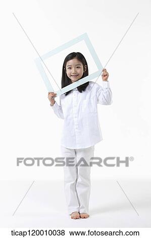 A girl with white frame View Large Photo Image Stock Photo - A girl with white frame. Fotosearch