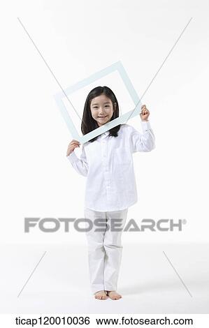 A girl with white frame View Large Photo Image Stock Photograph - A girl with white frame. Fotosearch