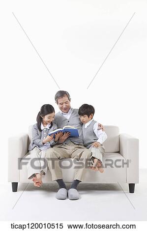 A grandfather and grandsons reading a book View Large Photo Image Stock Photography - A grandfather and grandsons reading a book. Fotosearch