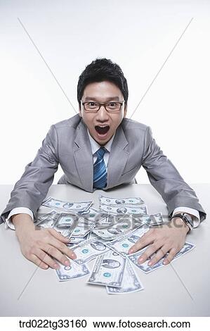 A happy businessman earning the big money View Large Photo Image Stock Image - A happy businessman earning the big money. Fotosearch
