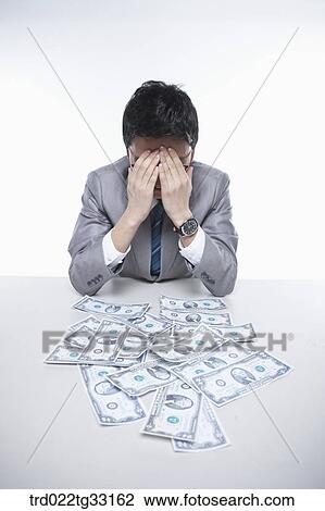 Stock Image - A happy businessman earning the big money. Fotosearch