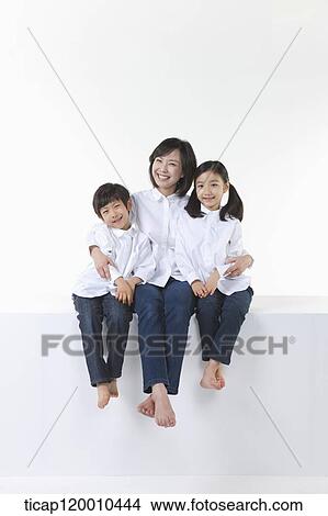 A happy family smiling together View Large Photo Image Picture - A happy family smiling together. Fotosearch