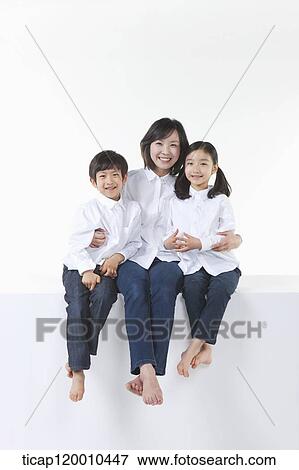 A happy family smiling together View Large Photo Image Stock Photo - A happy family smiling together. Fotosearch