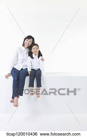 Stock Photograph - A happy mother and daughter. Fotosearch