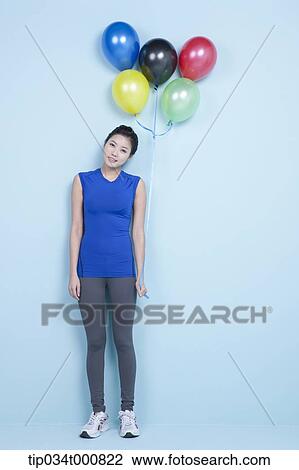 A jogging woman with colorful balloons View Large Photo Image Stock Image - A jogging woman with colorful balloons. Fotosearch