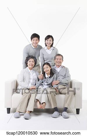 A large family around the couch View Large Photo Image Stock Image - A large family around the couch . Fotosearch