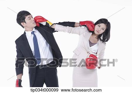 A man and woman punching on each other View Large Photo Image Stock Photo - A man and woman punching on each other. Fotosearch