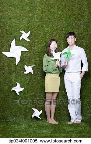 A man and woman with green and white pinwheels View Large Photo Image Stock Photography - A man and woman with green and white pinwheels. Fotosearch