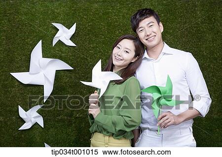 A man and woman with green and white pinwheels View Large Photo Image Stock Photography - A man and woman with green and white pinwheels. Fotosearch