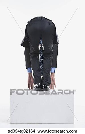 A man bending his waist toward the floor View Large Photo Image Picture - A man bending his waist toward the floor. Fotosearch