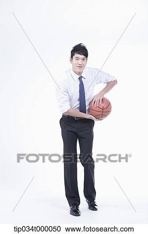 A man holding a basketball View Large Photo Image Stock Image - A man holding a basketball. Fotosearch