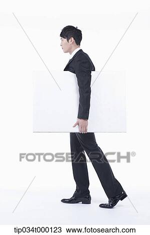 A man holding the white board View Large Photo Image Stock Image - A man holding the white board. Fotosearch