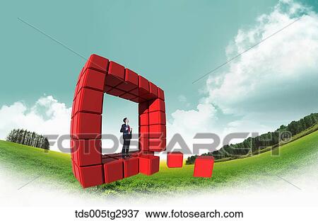 A man in the square shaped red boxes View Large Photo Image Stock Photo - A man in the square shaped red boxes. Fotosearch