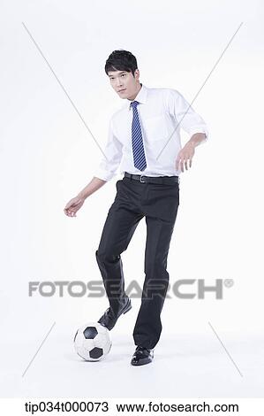 A man kicking a soccer ball View Large Photo Image Stock Image - A man kicking a soccer ball. Fotosearch