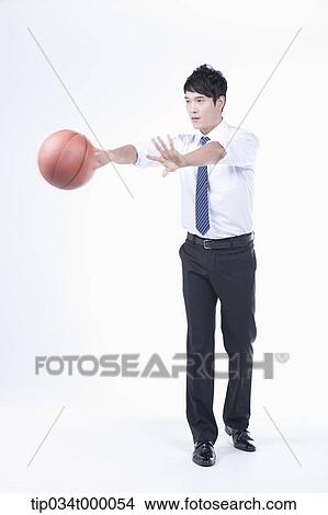 A man passing a basketball View Large Photo Image Picture - A man passing a basketball. Fotosearch