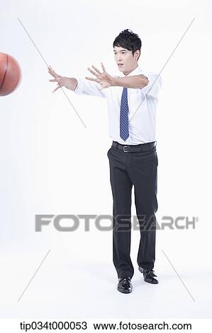 A man passing a basketball View Large Photo Image Stock Image - A man passing a basketball. Fotosearch