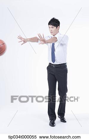 A man passing a basketball View Large Photo Image Stock Photography - A man passing a basketball. Fotosearch