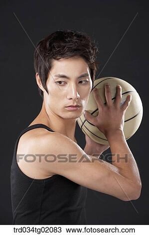 A man playing basketball View Large Photo Image Stock Image - A man playing basketball. Fotosearch