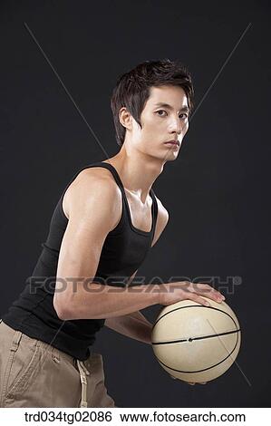 A man playing basketball View Large Photo Image Stock Photograph - A man playing basketball. Fotosearch