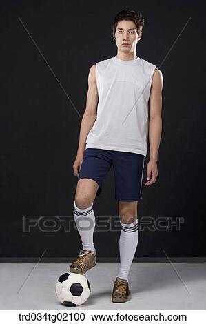 A man playing soccer View Large Photo Image Stock Image - A man playing soccer. Fotosearch