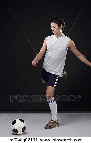 A man playing soccer View Large Photo Image Stock Image - A man playing soccer. Fotosearch
