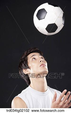 A man playing soccer View Large Photo Image Stock Image - A man playing soccer. Fotosearch
