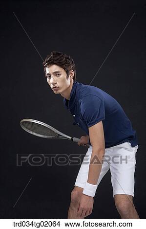 A man playing tennis View Large Photo Image Picture - A man playing tennis. Fotosearch