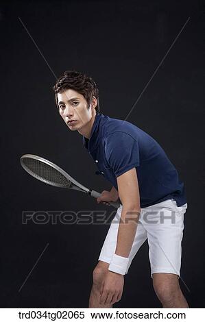 A man playing tennis View Large Photo Image Stock Photography - A man playing tennis. Fotosearch