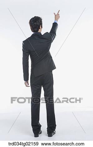 Stock Photo - A man pointing something with his finger. Fotosearch