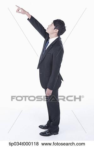 A man pointing to the sky View Large Photo Image Stock Photo - A man pointing to the sky . Fotosearch