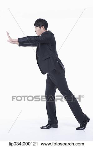 A man pushing on the front View Large Photo Image Stock Image - A man pushing on the front. Fotosearch