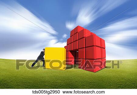 A man pushing the yellow box into other piled red boxes View Large Photo Image Stock Image - A man pushing the yellow box into other piled red boxes. Fotosearch