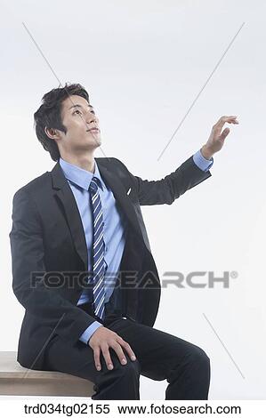 Stock Photography - A man reaching his arm . Fotosearch