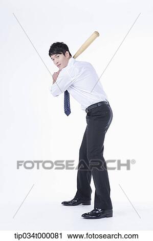 A man ready to swing a bat View Large Photo Image Stock Image - A man ready to swing a bat. Fotosearch