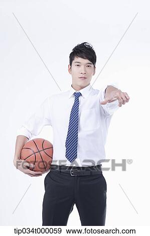 A man stretching his hand with a basketball View Large Photo Image Stock Photo - A man stretching his hand with a basketball. Fotosearch