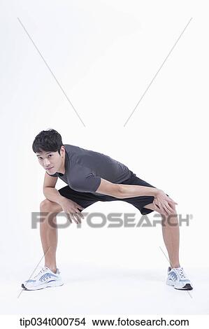 A man stretching his legs View Large Photo Image Picture - A man stretching his legs. Fotosearch