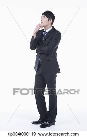 Stock Photo - A man thinking with his hand on the chin . Fotosearch