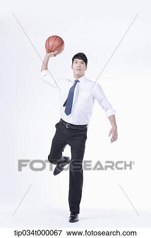 A man throwing a basketball View Large Photo Image Stock Photo - A man throwing a basketball. Fotosearch