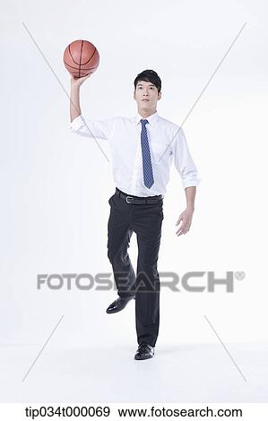 A man throwing a basketball View Large Photo Image Stock Photo - A man throwing a basketball. Fotosearch