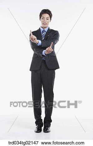 Stock Photo - A man touching something with his finger. Fotosearch